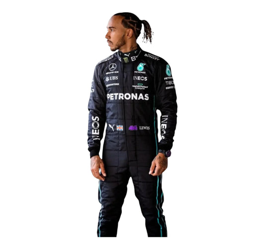Person wearing a black racing suit with various sponsor logos on a white background