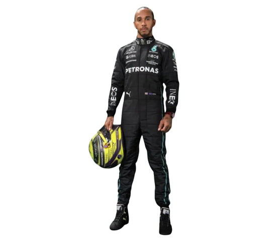 Person wearing a Formula 1 racing suit with helmet on a white background