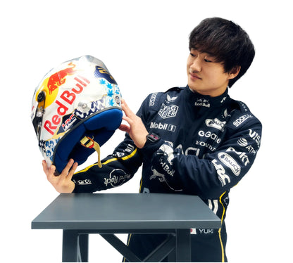Person holding a colorful helmet with visible branding