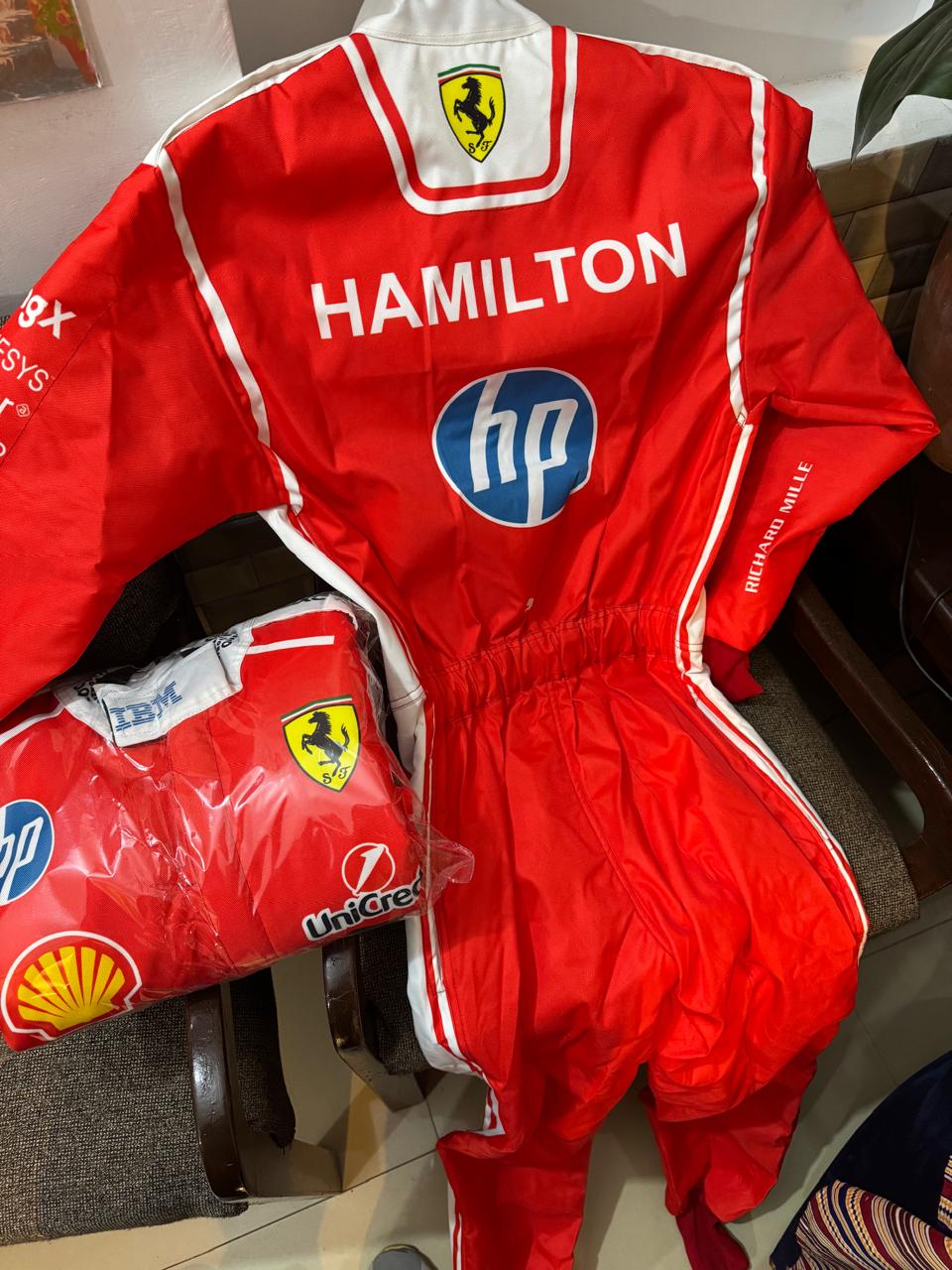 New 2026 Ferrari Race Suit Available in Lewis Hamilton and Charles Leclerc and and flag