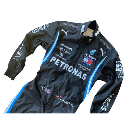 Black racing suit with various sponsor logos on a white background